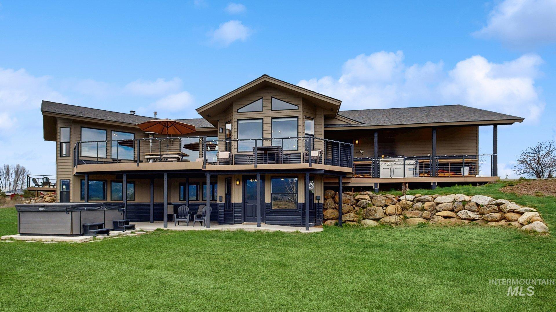 14100 Pioneer Road McCall, ID 83638 - Photo 1 of 1 Expansive rear exterior featuring multiple outdoor living spaces