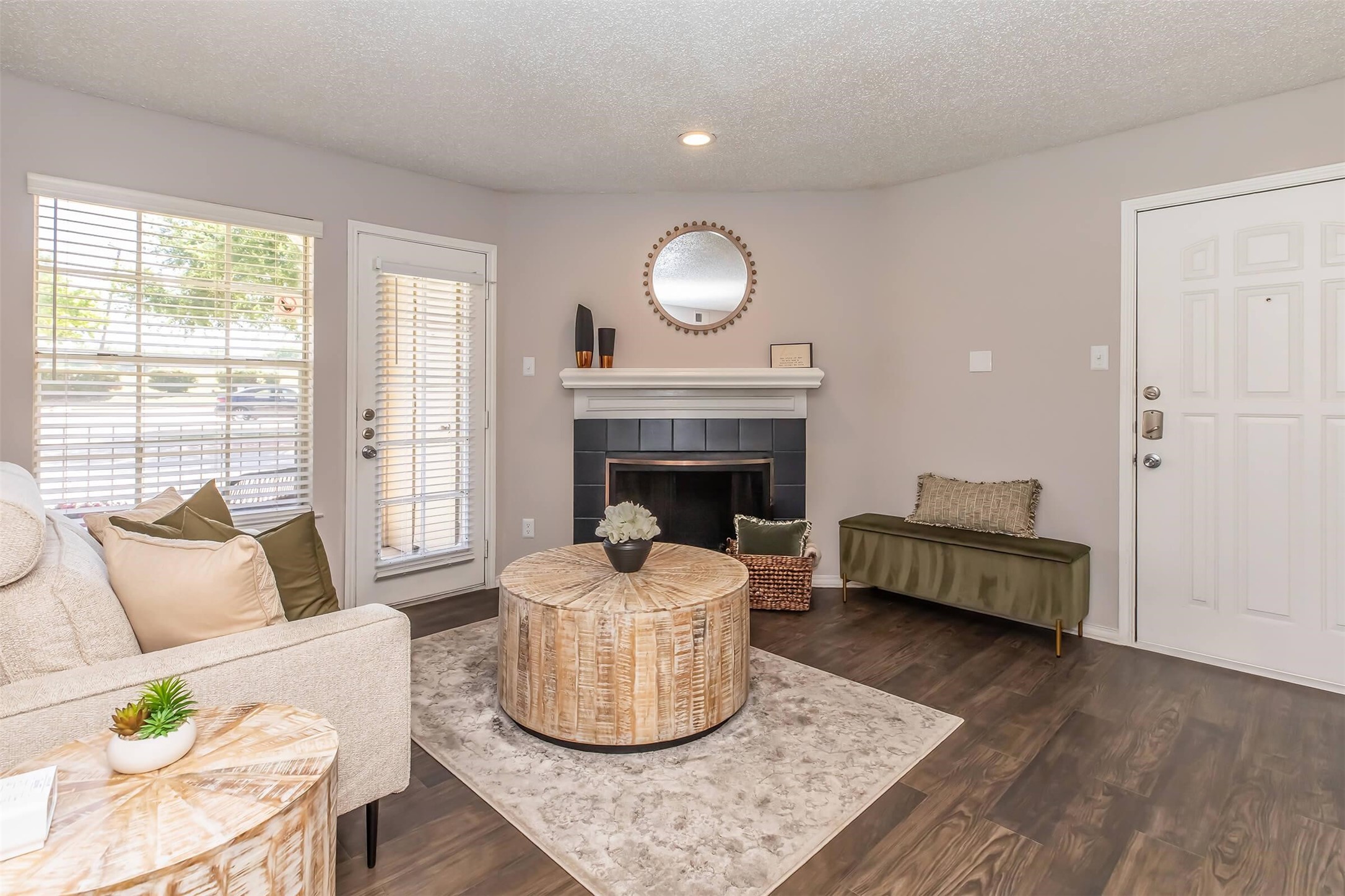 a living room with furniture and a fireplace