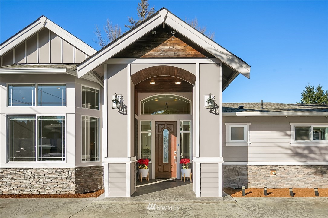 10902 Southeast 186th Street Renton, WA 98055 - Photo 1 of 32 a front view of a house with a porch
