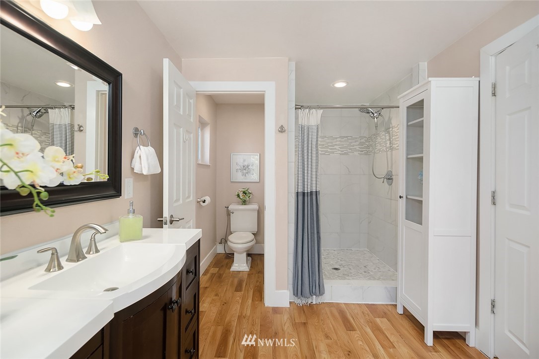 10902 Southeast 186th Street Renton, WA 98055 - Photo 20 of 32 a bathroom with a sink and a mirror