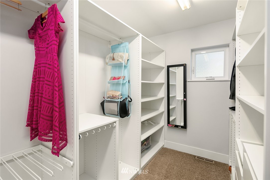 10902 Southeast 186th Street Renton, WA 98055 - Photo 21 of 32 a view of walk in closet with clothes and shoes