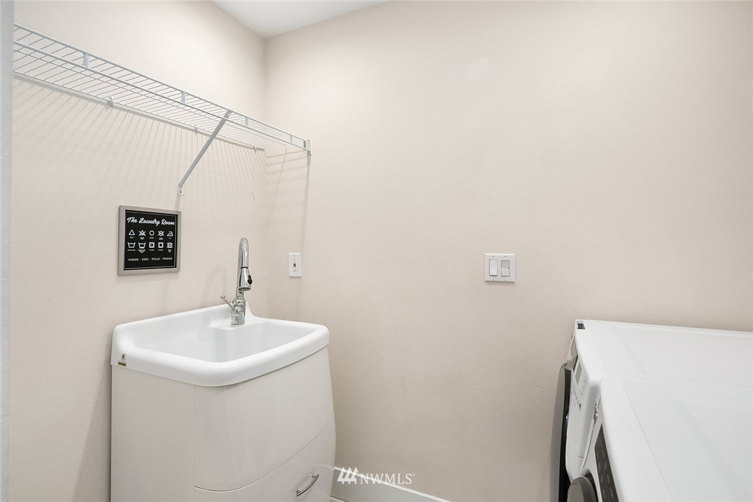 10902 Southeast 186th Street Renton, WA 98055 - Photo 25 of 32 a bathroom with a sink and mirror