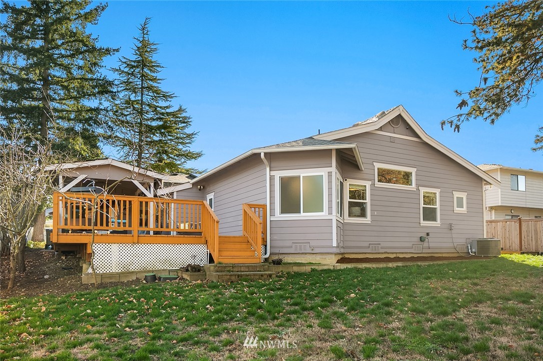 10902 Southeast 186th Street Renton, WA 98055 - Photo 29 of 32 a front view of a house with a yard