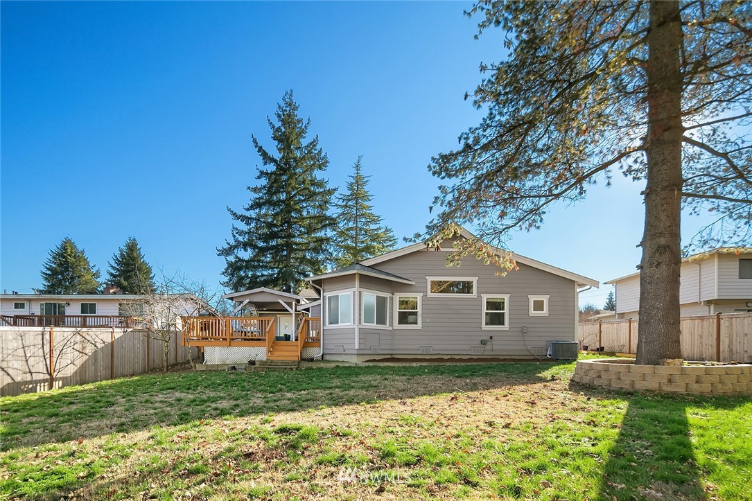 10902 Southeast 186th Street Renton, WA 98055 - Photo 30 of 32 a front view of a house with a yard