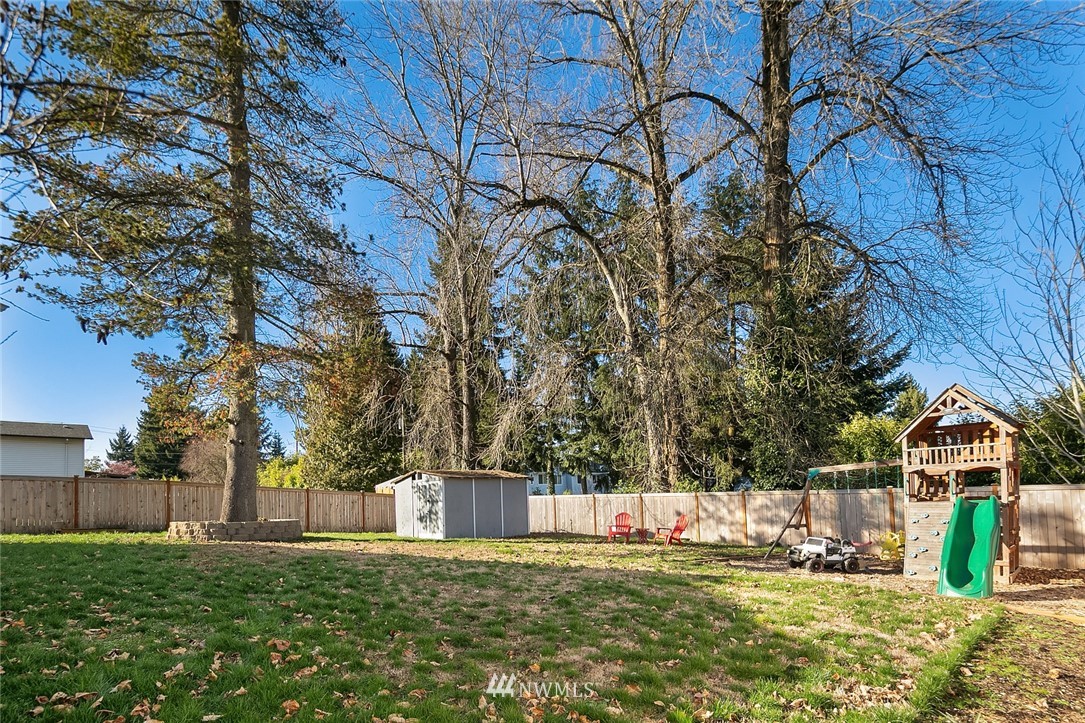 10902 Southeast 186th Street Renton, WA 98055 - Photo 32 of 32 a view of swimming pool with an outdoor space and seating