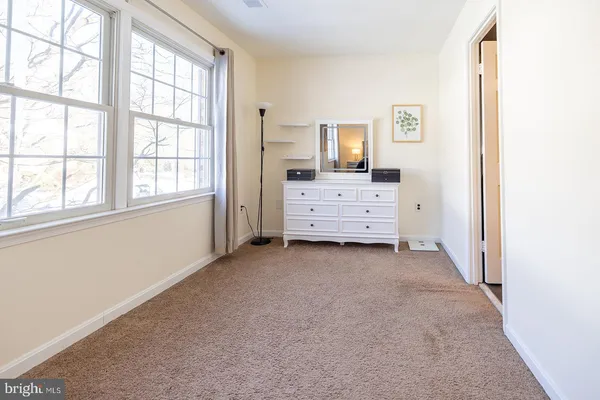 a view of room with cabinet and mirror