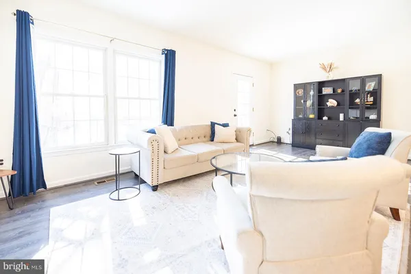 a living room with furniture and window