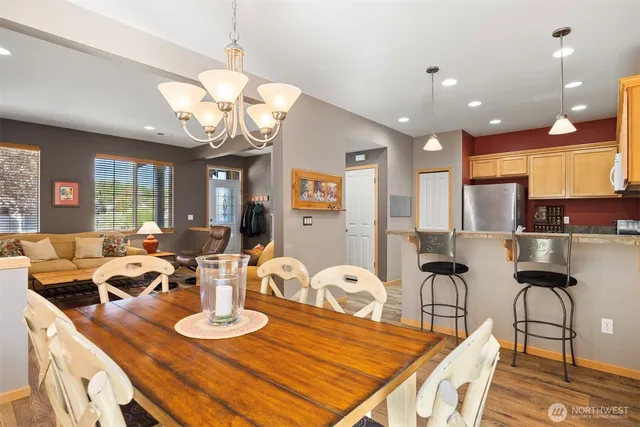 a view of a dining room with furniture and wooden floor