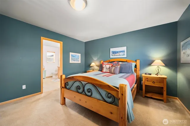 a bedroom with bed and a window