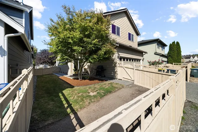 a view of an house with backyard and kitchen