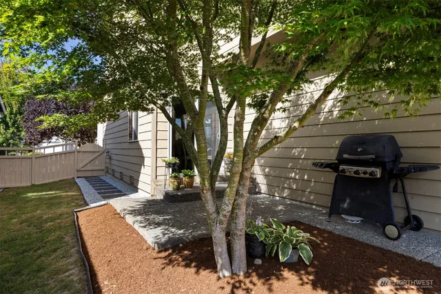 a view of a backyard with sitting area