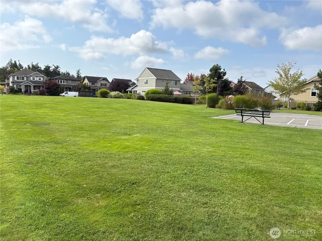 a view of a backyard with sitting area