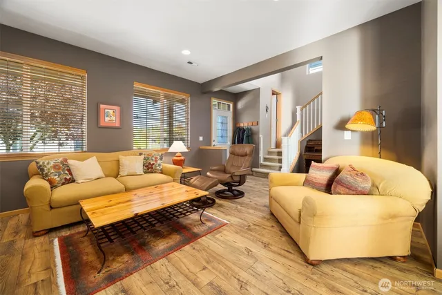 a living room with furniture and a large window