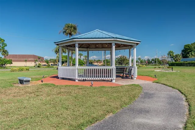 a view of a park with wooden fence