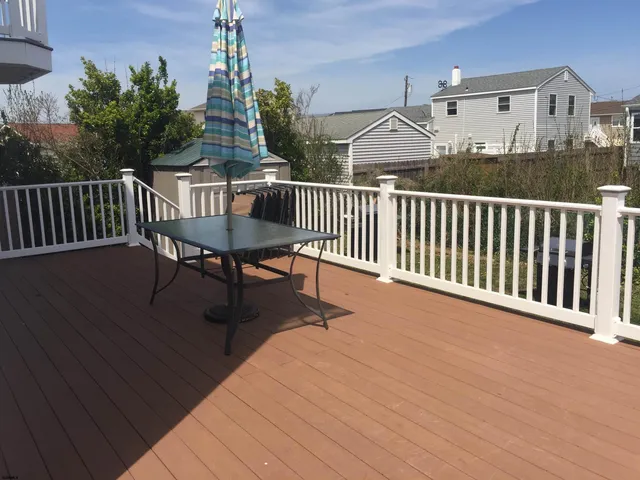 a view of a balcony with furniture