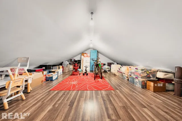 a living room with lots of furniture and wooden floor