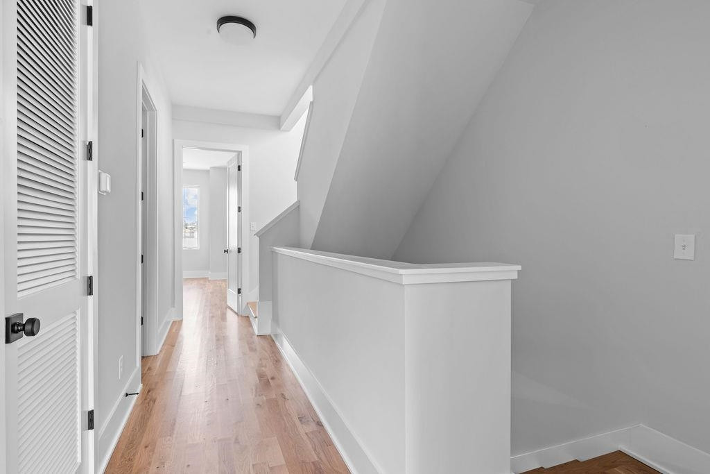 617 South West Street Raleigh, NC 27601 - Photo 16 of 44 a view of a hallway with a wooden floor