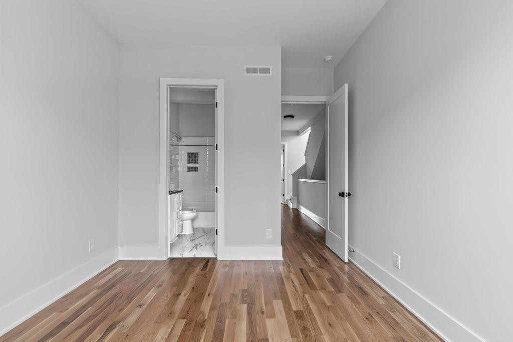 617 South West Street Raleigh, NC 27601 - Photo 20 of 44 a view of hallway with wooden floor
