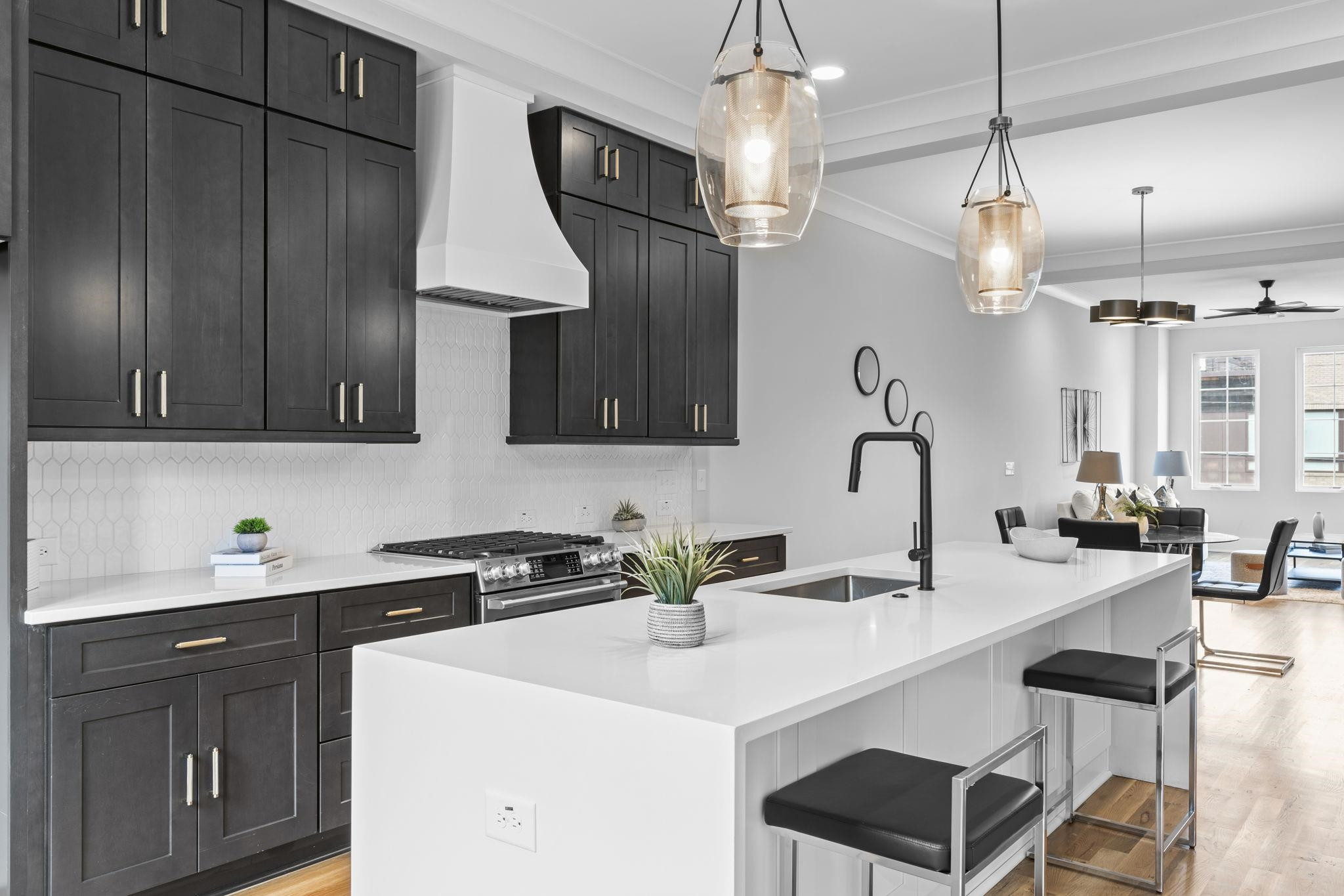 617 South West Street Raleigh, NC 27601 - Photo 2 of 44 a kitchen with a sink a cabinets and chairs