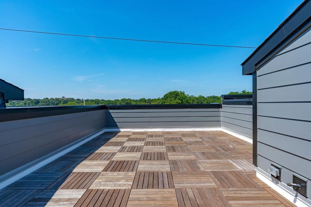617 South West Street Raleigh, NC 27601 - Photo 30 of 44 a view of balcony with wooden floor and lake view