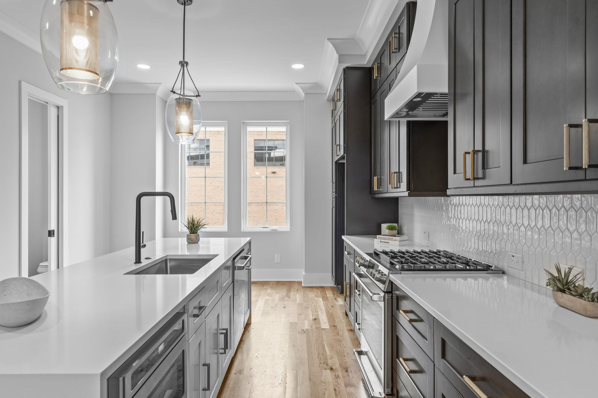 617 South West Street Raleigh, NC 27601 - Photo 4 of 44 a kitchen with kitchen island granite countertop a sink stove and cabinets