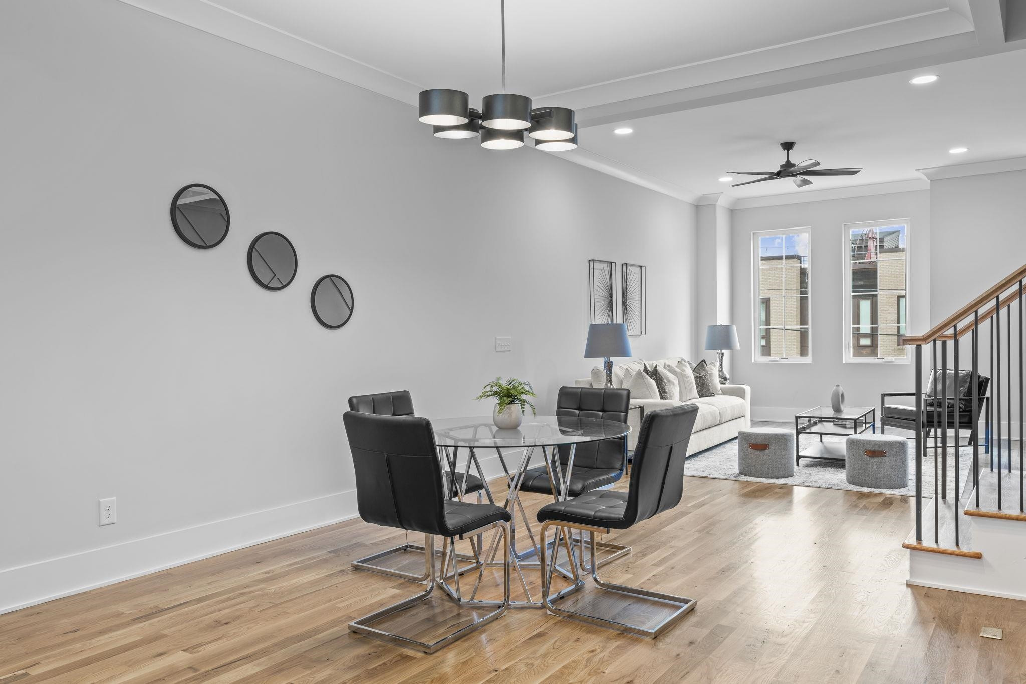 617 South West Street Raleigh, NC 27601 - Photo 5 of 44 a view of a dining room with furniture wooden floor and chandelier