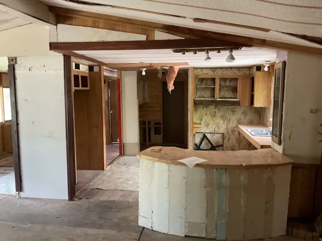 a room with sink and mirror