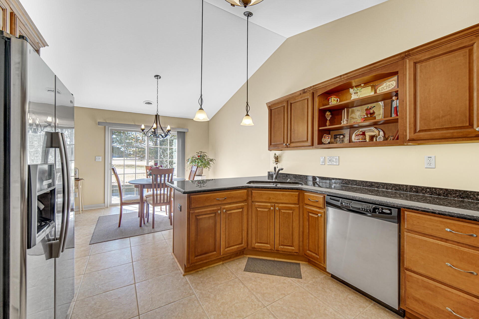 805 Veterans Lane Crown Point, IN 46307 - Photo 13 of 34 a kitchen with stainless steel appliances granite countertop a refrigerator and a sink
