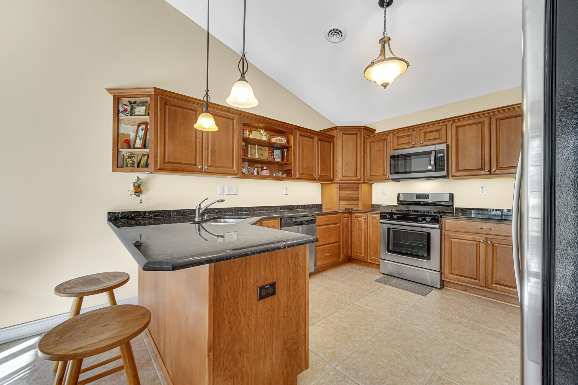 805 Veterans Lane Crown Point, IN 46307 - Photo 14 of 34 a kitchen with stainless steel appliances granite countertop a sink and a stove
