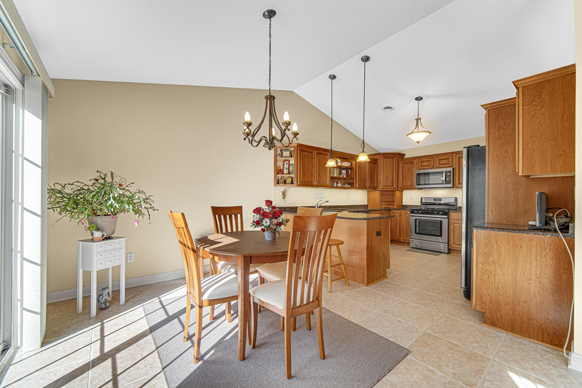 805 Veterans Lane Crown Point, IN 46307 - Photo 16 of 34 a view of a dining room and livingroom with furniture wooden floor a chandelier