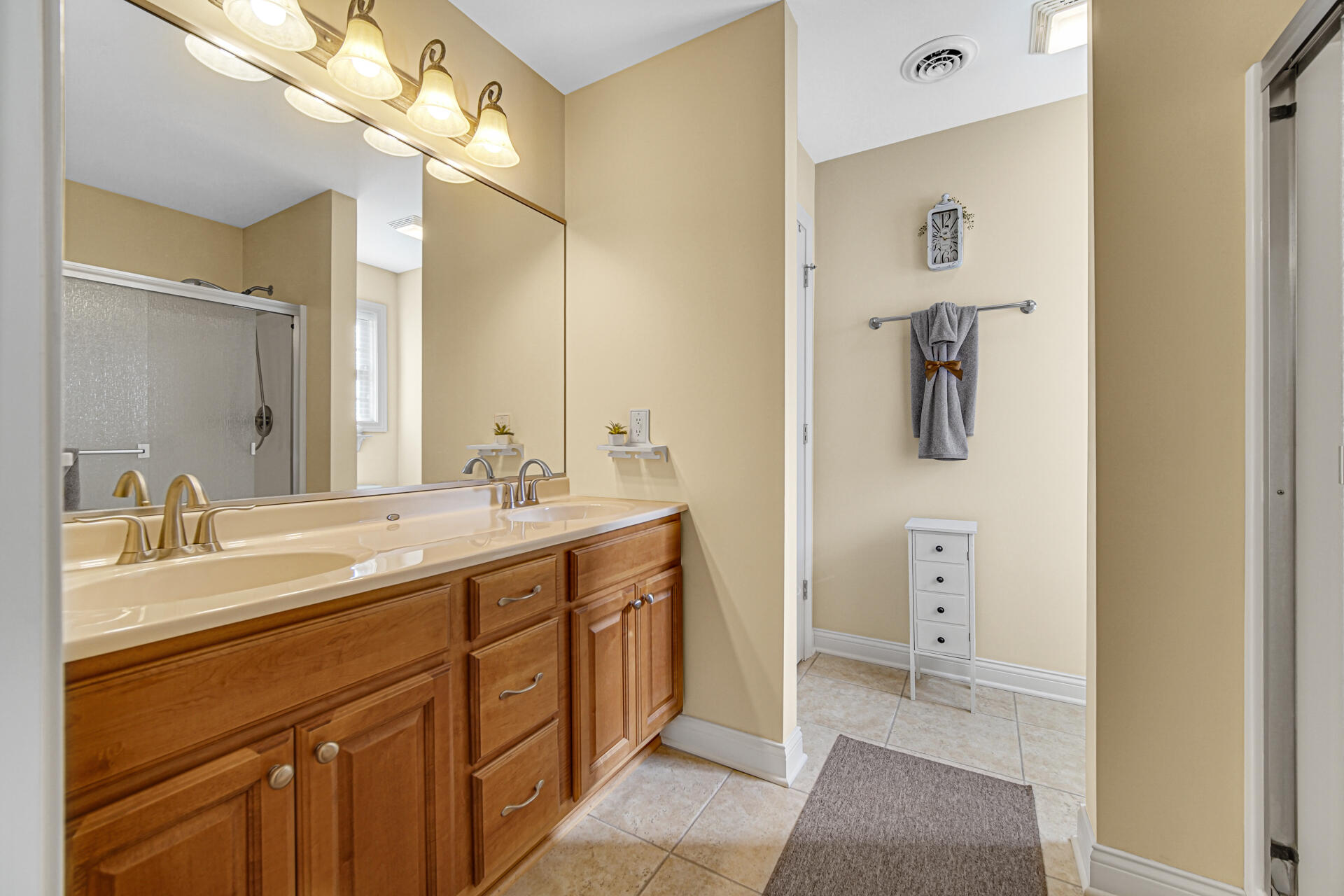805 Veterans Lane Crown Point, IN 46307 - Photo 19 of 34 a spacious bathroom with a double vanity sink mirror and