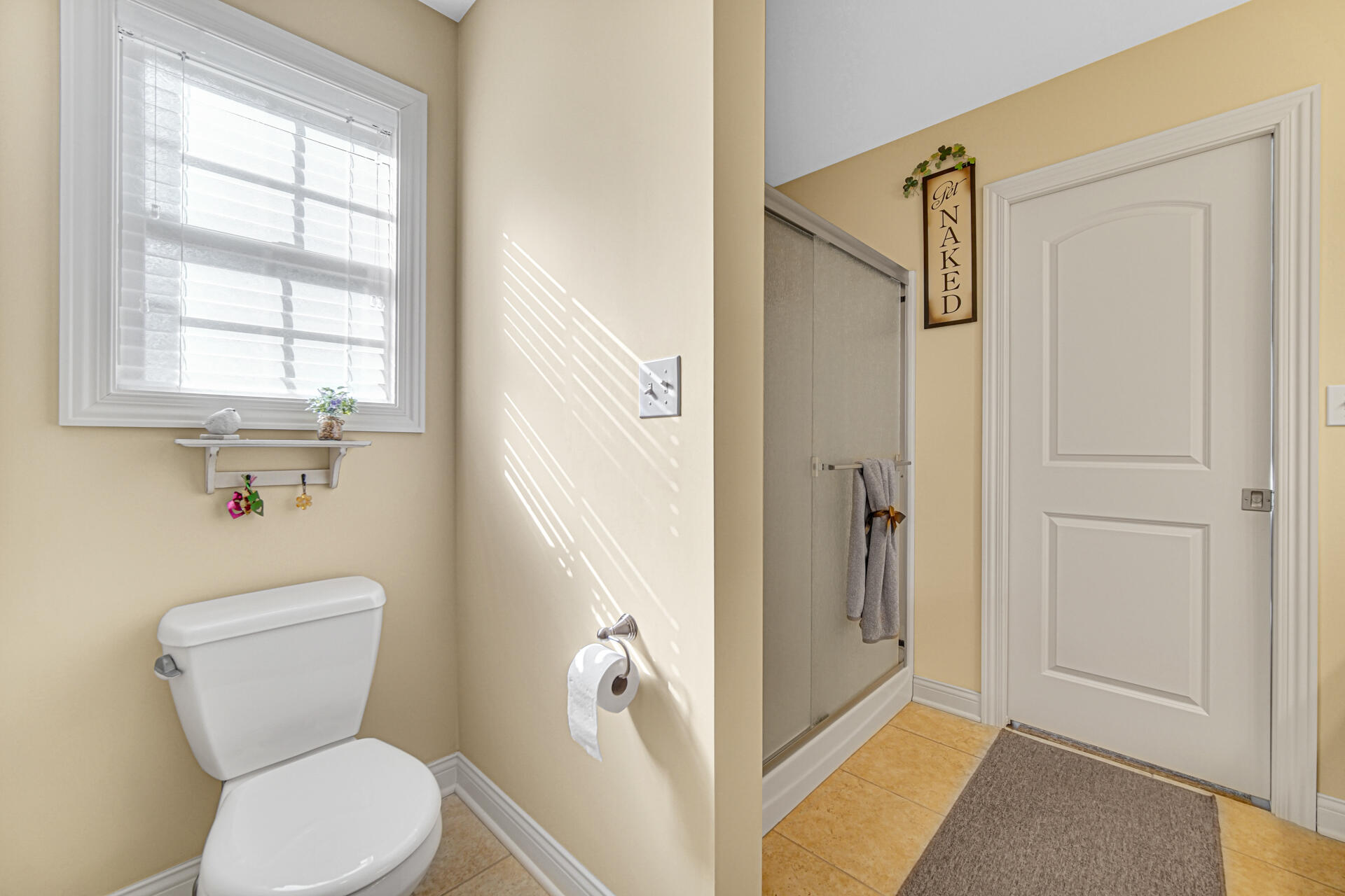 805 Veterans Lane Crown Point, IN 46307 - Photo 20 of 34 a white toilet sitting next to a bathroom sink