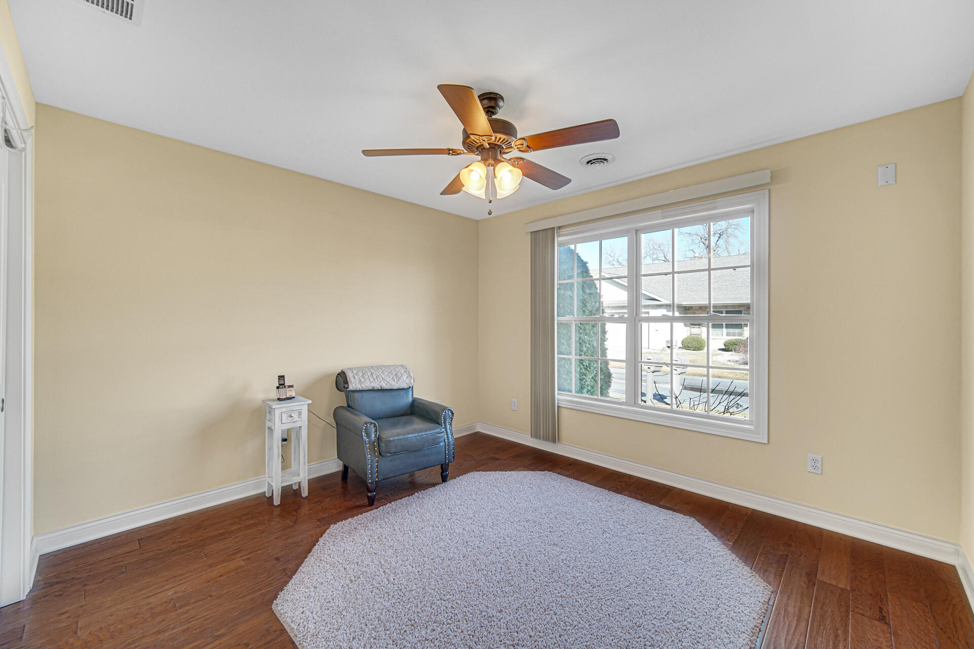 805 Veterans Lane Crown Point, IN 46307 - Photo 21 of 34 a bedroom with a bed and wooden floor