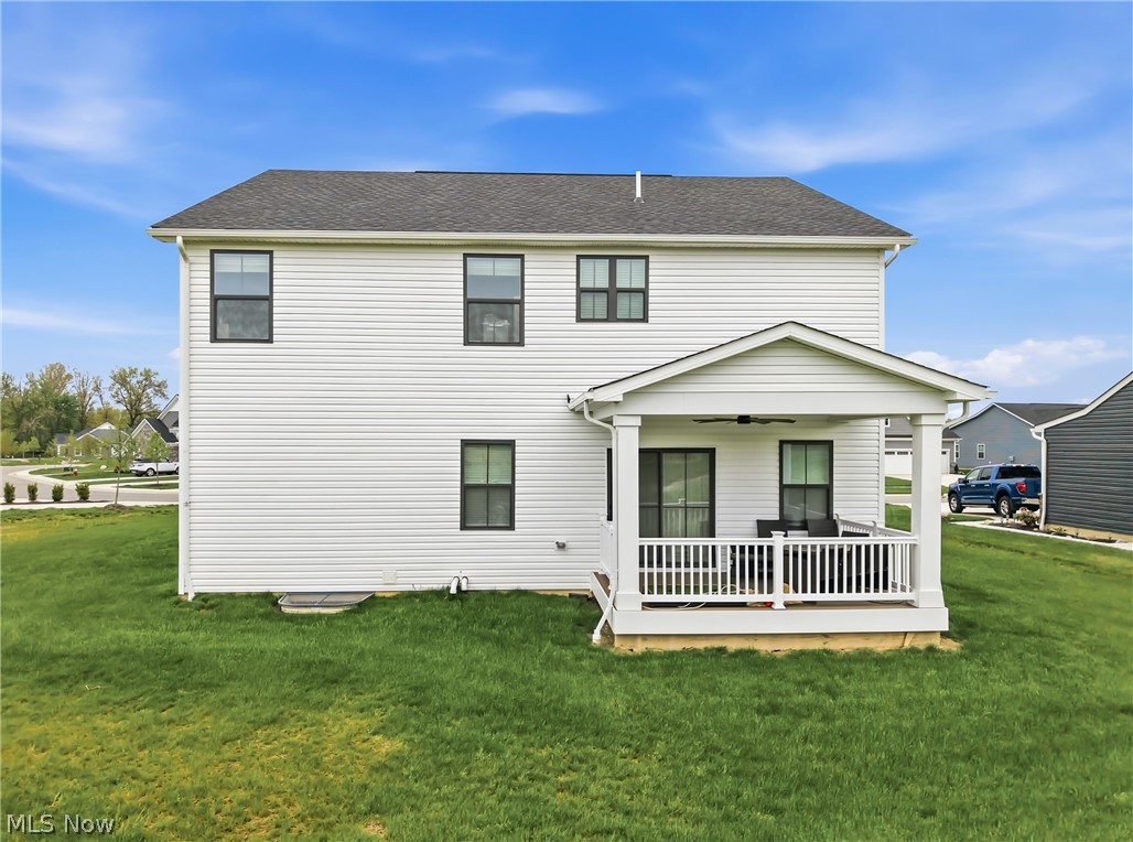 5358 Walnut Rdg Lane Sheffield Lake, OH 44054 - Photo 41 of 50 White siding exterior featuring black-framed windows and a covered porch
