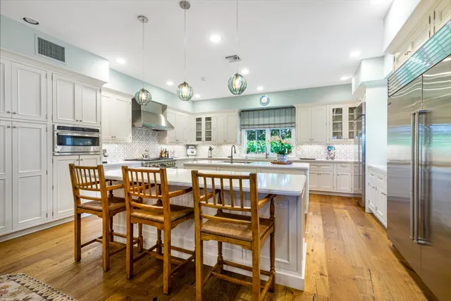 a spacious bedroom with a bed and a large window