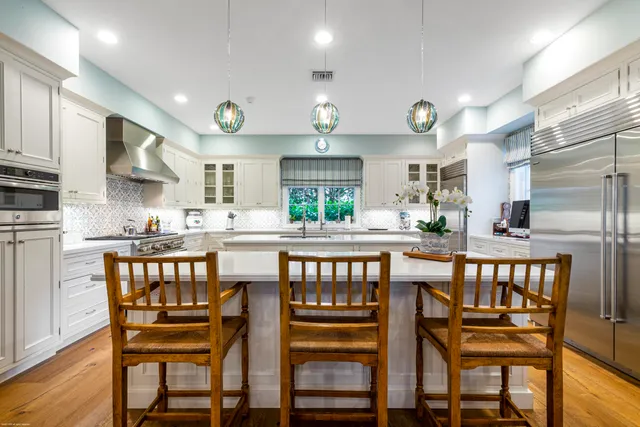 a bathroom with a sink toilet and a mirror