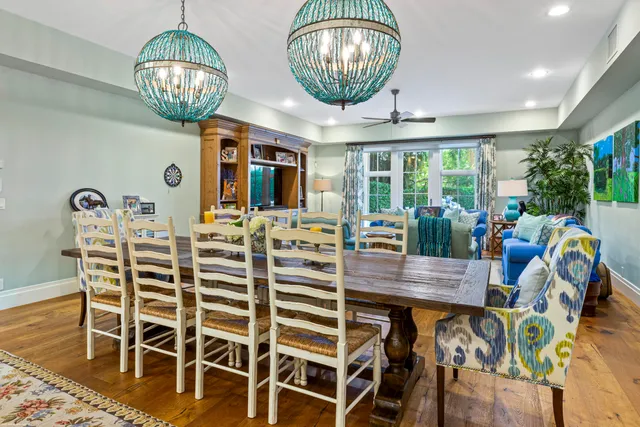 a bedroom with two beds and a large window