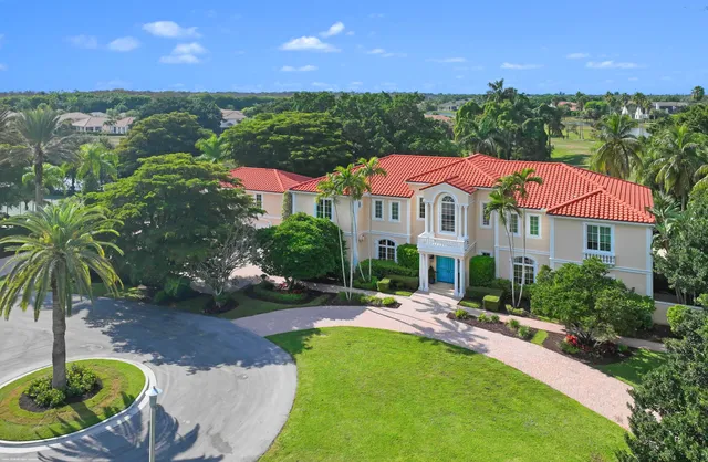 a view of a house with a backyard porch and sitting area