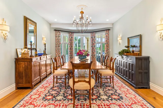 a very nice looking living room with furniture and a floor to ceiling window