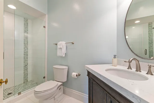 a bedroom with two beds and a large window