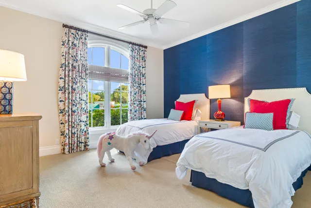 a bathroom with a granite countertop toilet sink and mirror