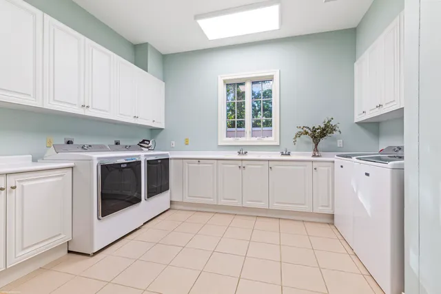 a bathroom with a granite countertop toilet and a sink