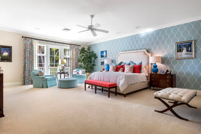 an aerial view of a house with a swimming pool patio and outdoor seating
