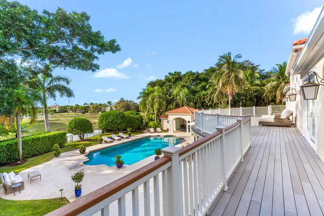 a view of a swimming pool with a yard