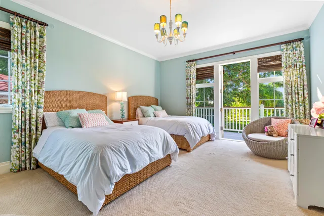 an aerial view of residential houses with outdoor space and swimming pool