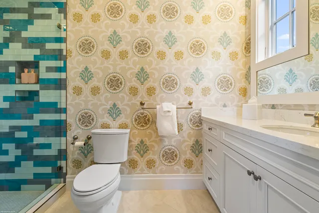 an aerial view of a house with swimming pool and garden