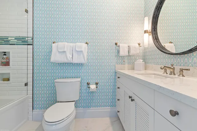 an aerial view of residential houses with outdoor space and pool