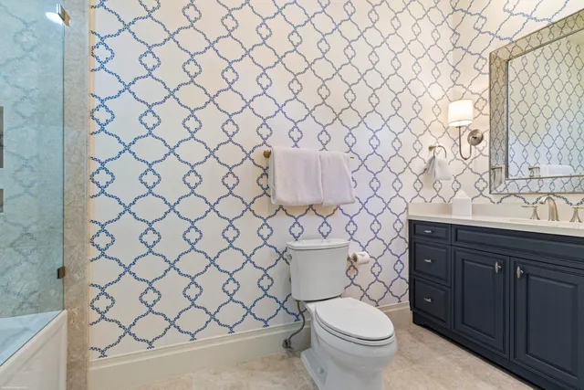 an aerial view of a house with garden space and lake view