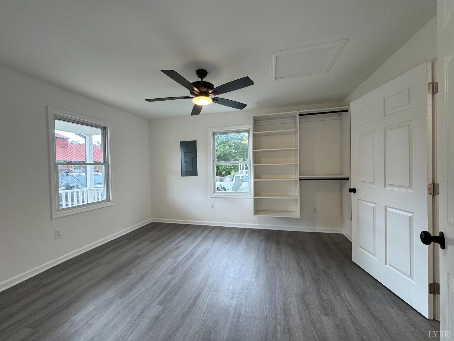 287 Harrell Street Appomattox, VA 24522 - Photo 15 of 17 an empty room with wooden floor and windows