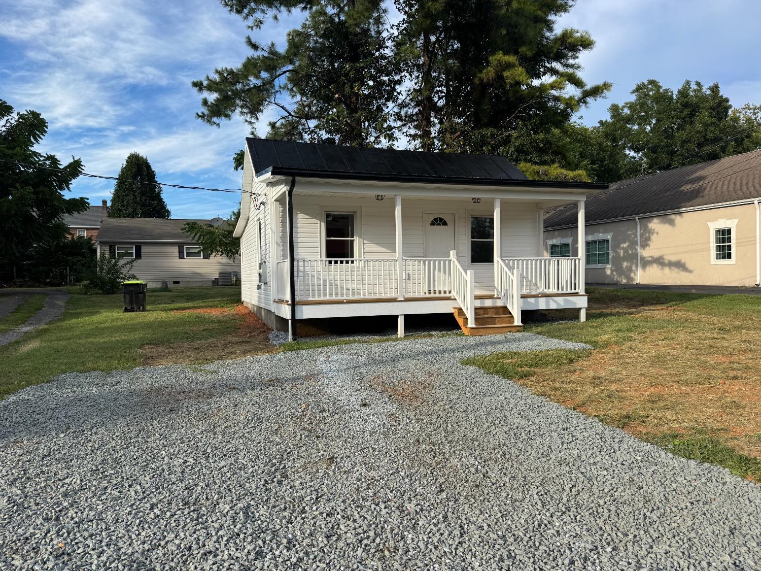 287 Harrell Street Appomattox, VA 24522 - Photo 2 of 17 a view of a house with backyard and trees